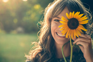 Woman with Sunflower over eye