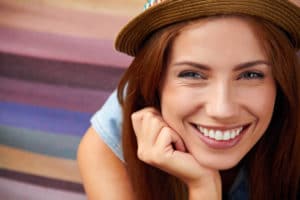 Smiling girl in hat 300x200 1