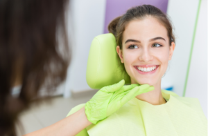 Dentist exam of young teen girl teeth.