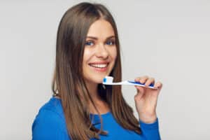 Smiling,Woman,Holding,Toothy,Brush.,Portrait,Isolated,On,White.