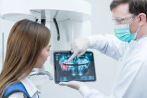 Young woman who suffers from chronic pain having a dental consultation in a comfortable environment